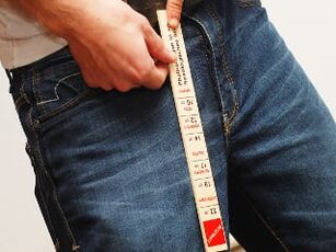 Man measures penis length